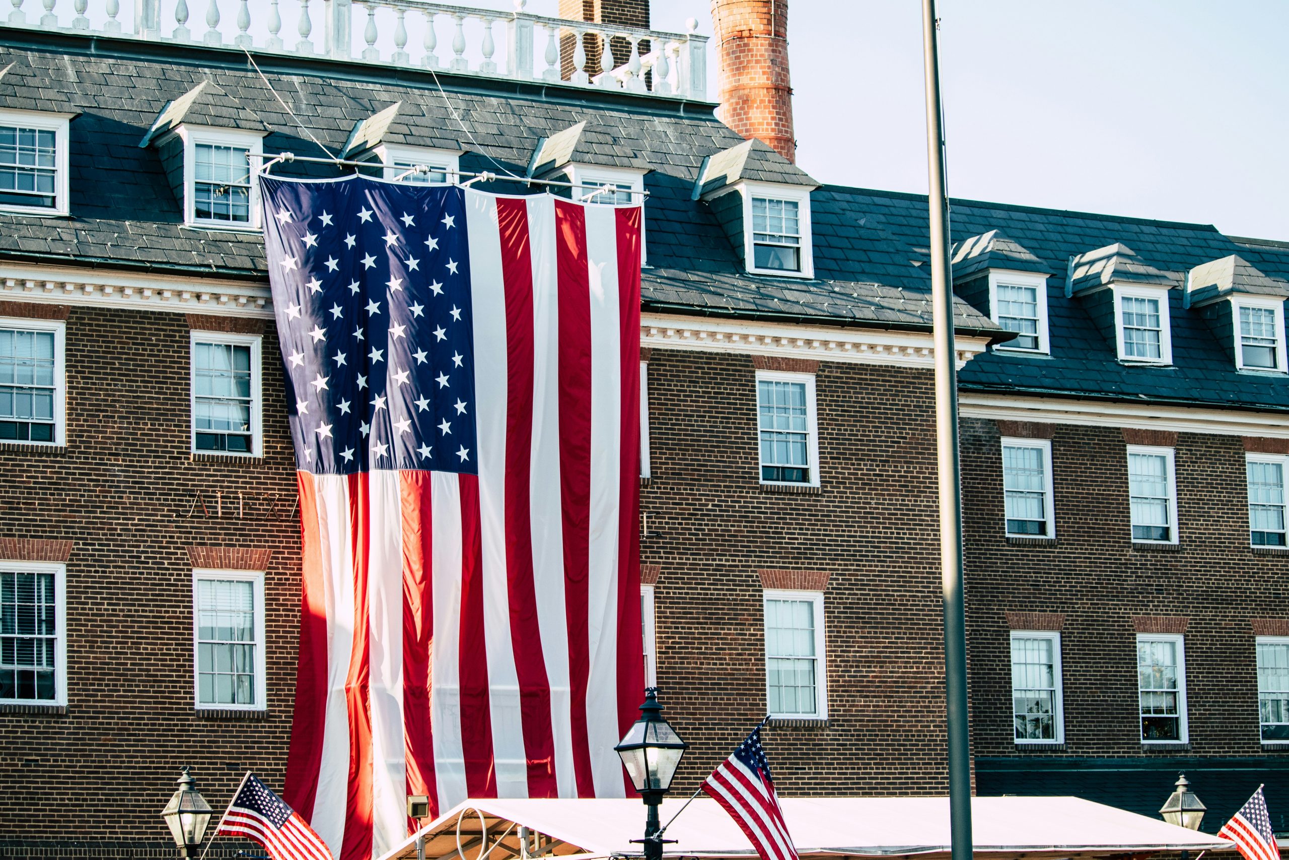 City Hall in Alexandria, VA with an American flag